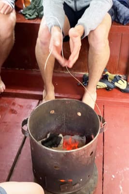 The bucket of coals to provide some warmth on the boat
